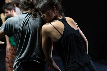 couple dancers move in contact improvisation performance