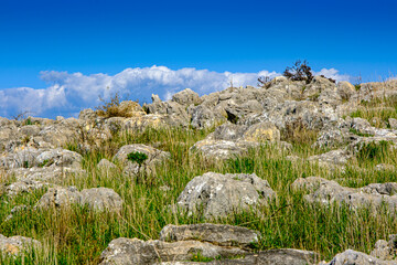 Fototapeta na wymiar View of rocky landscape with blue sky background
