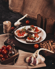 Sandwiches with cheese and tomatoes on the table