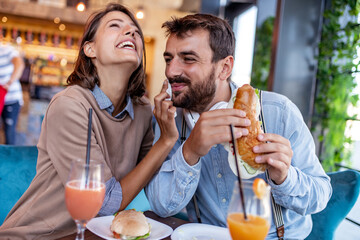 Couple have breakfast in cafe
