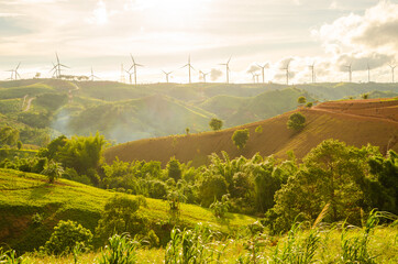 wind turbine on the peak mountain with sky evening background. © Sawat