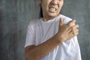 young asian woman with pain in shoulder, Ache in human body , office syndrome , health care concept