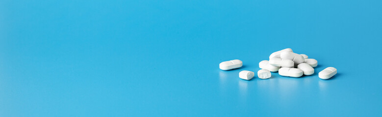 White Pills On Blue Background Banner