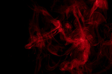 Abstract red smoke  on a black background.  The steam generator. The concept of poison gas. 