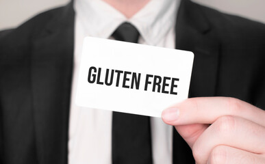 Businessman holding a card with text Gluten Free