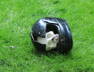 broken motorcycle helmet on the ground