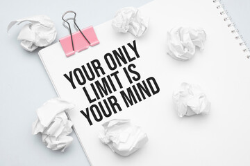 Your only limit is your mind. Blank sheet of paper, red paper clip, word Ideas and crumpled paper wads