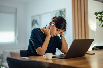 Tired businesswoman searching for a solution for a work problem.