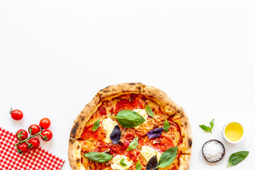 Margherita italian pizza with tomatoes cheese and basil, top view