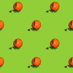 Pattern of Fresh orange citrus fruit with leaf isolated on green background.