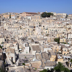 Matera, Italy - August 17, 2020: View of the Sassi di Matera a historic district in the city of Matera, well-known for their ancient cave dwellings. Basilicata. Italy