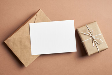 Invitation or greeting card mockup with envelope and gift box