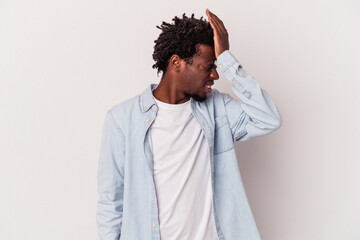 Young african american man isolated on white background  forgetting something, slapping forehead with palm and closing eyes.