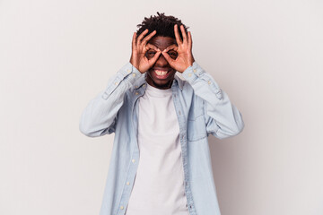 Young african american man isolated on white background  excited keeping ok gesture on eye.