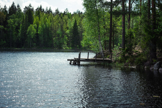 lake in the forest with a wooden pier