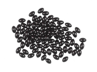 black medical pills isolated on white background