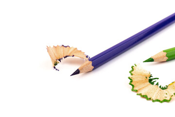 Wooden pencil whith shavings and colorful crumbs of graphite from sharpener. Back to school concept.