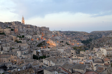 Fototapeta na wymiar Matera, Italy - August 17, 2020: View of the Sassi di Matera a historic district in the city of Matera, well-known for their ancient cave dwellings. Basilicata. Italy