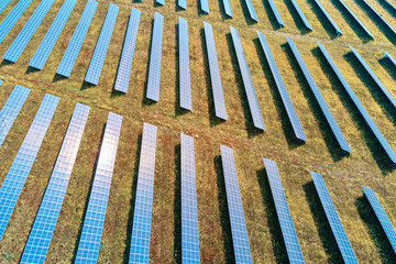 Row of solar panels in the field. Solar battery farm, aerial view. Alternative renewable energy concept
