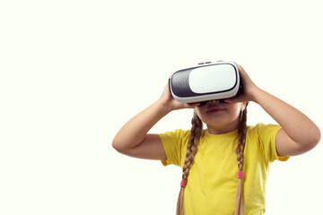 Little caucasian girl with a virtual reality headset on a white background. The concept of...