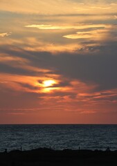 sunset over the sea with eye in the cloud