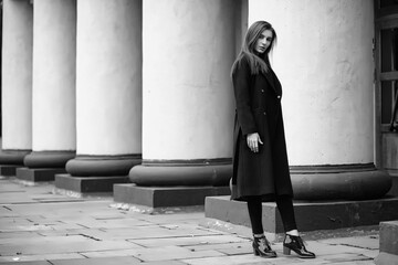 Obraz premium Girl in a coat black and white photo