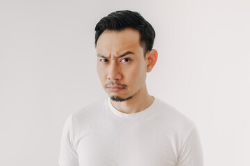 Grumpy face Asian man in white t-shirt isolated on white background.