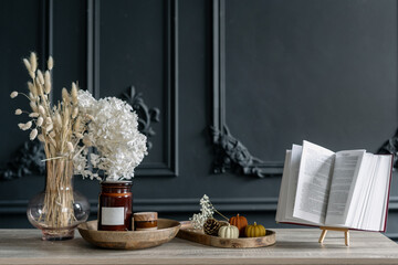 Furniture with different decorations against relief wall