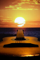 Guitar on the background of the sun