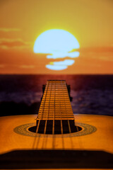 Guitar on the background of the sun