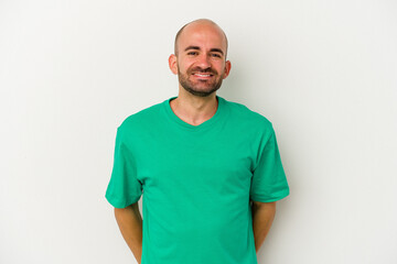 Young bald man isolated on white background happy, smiling and cheerful.