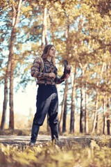Fototapeta premium Cowboy with hat in a field in autumn