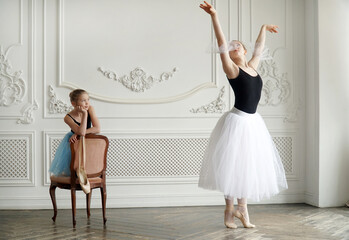 little ballerina looks at an adult ballerina and dreams. Student teacher mentor experience