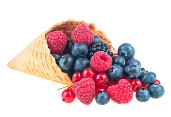 Fresh berries in waffle cup isolated on a white background. Raspberry, blueberry, red currant and blackberry.