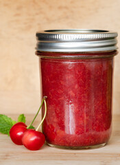Jar of Jam with Red Cherries