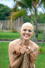 Portrait Beautiful and strong bald woman fighting breast cancer. Happy and overcoming illness. holding shawl sensually