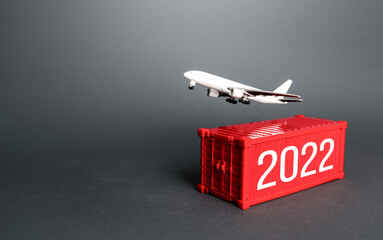 Airplane and 2022 year ship container. Analytics forecasting of freight traffic next year....