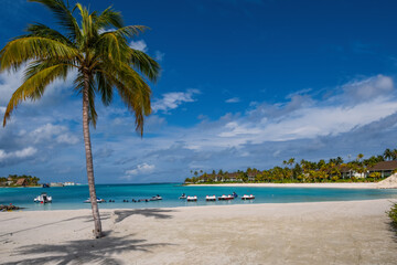tropical beach with catamarans in Maldives Crossroads. July 2021