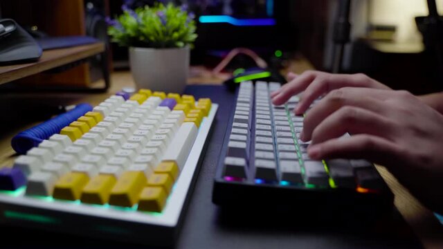 Footage of a man hand typing on his mechanical gaming RGB keyboard with stylish keycaps with ASMR thocc sounds