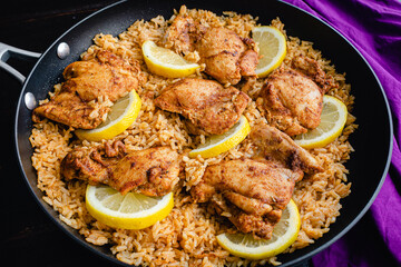 One Pan Spanish Chicken and Rice in a Skillet: Chicken thighs and rice seasoned with smoked paprika, garlic, and other spices