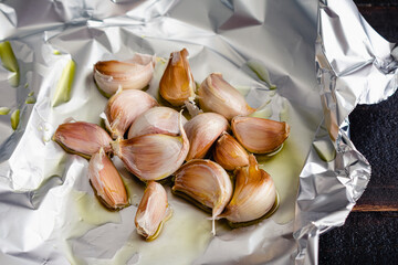 Whole Garlic Cloves on Drizzled with Extra Virgin Olive Oil: Garlic cloves drizzled with olive oil...