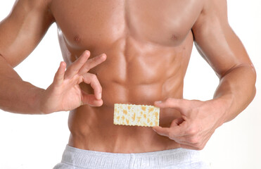 Fitness shape man body abdominals holding a cracker soda on diet concept.