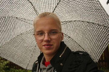 girl with open umbrella, rainy weather, autumn