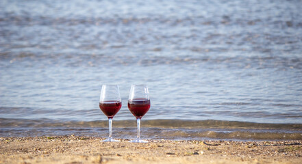 Picnic blanket, wine, fruit, beautiful sea beach Nature Selective focus