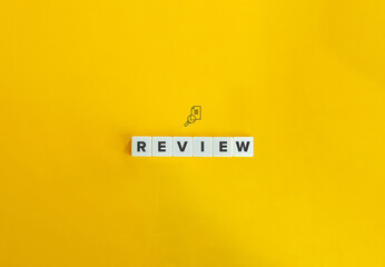 Review banner and concept. Block letters on bright orange background. Minimal aesthetics.