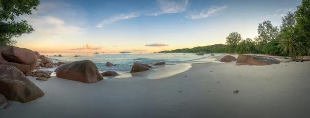 Gordijnen sunset at tropical beach anse lazio on praslin, seychelles © Christian B.
