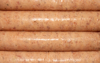 	 Chicken meat kupaty.Chicken sausages are a chopped meat semi-finished product.Background of chicken sausages.	
