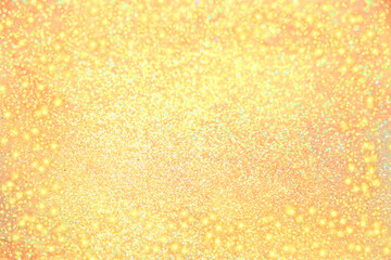 Abstract defocused yellow background with bokeh, magic glitter and blur, festive bright banner. Frame for Thanksgiving, Autumn, Halloween or Christmas Party. 