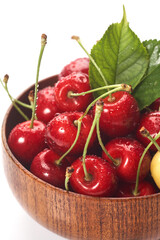 Cherry In wooden Bowl Isolated On White Background