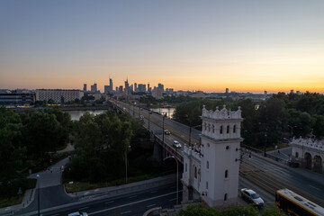 wieżowce w cetrum Warszawy, rzeka Wisła, most Poniatowskiego o zachodzie słońca z lotu ptaka, dron © Arkadiusz